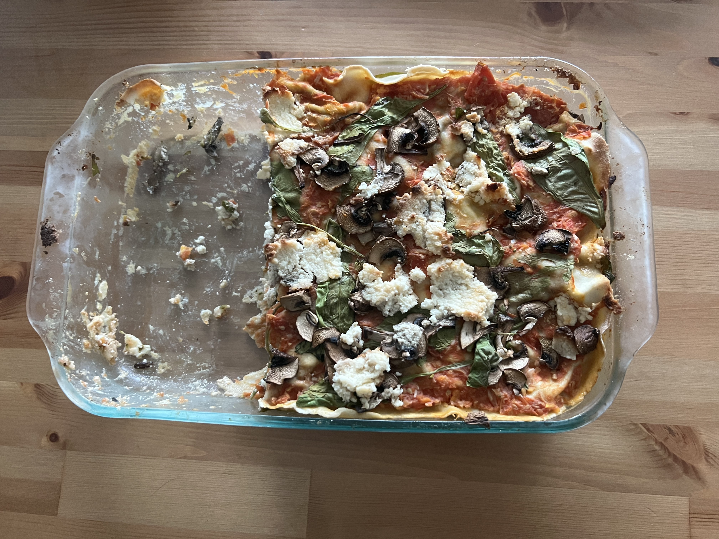 Vegan mushroom spinach lasagna made entirely from scratch using homemade pasta, vegan almond ricotta, and tomato sauce