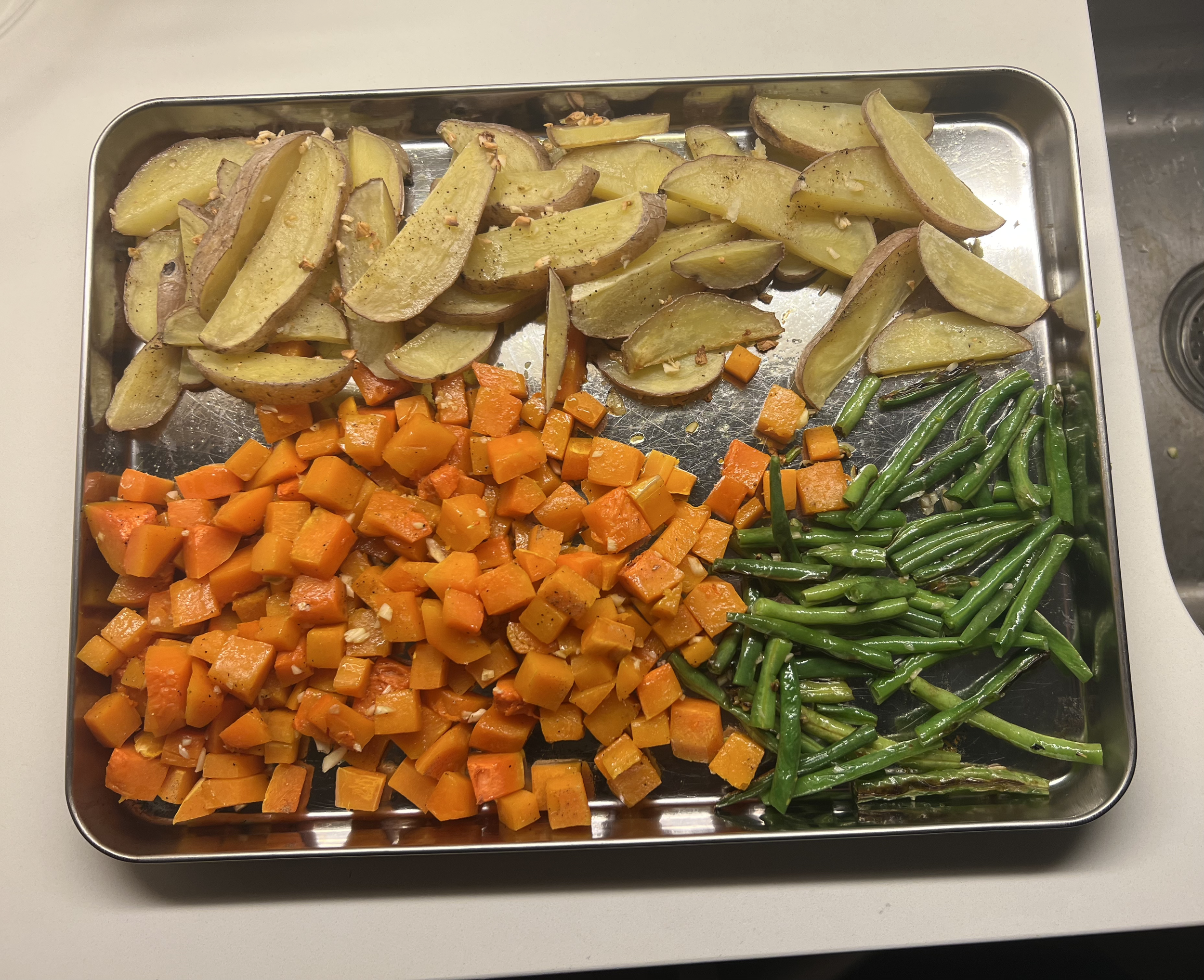 Cubed butter nut squash with sautéed green beans and homemade baked French fries 