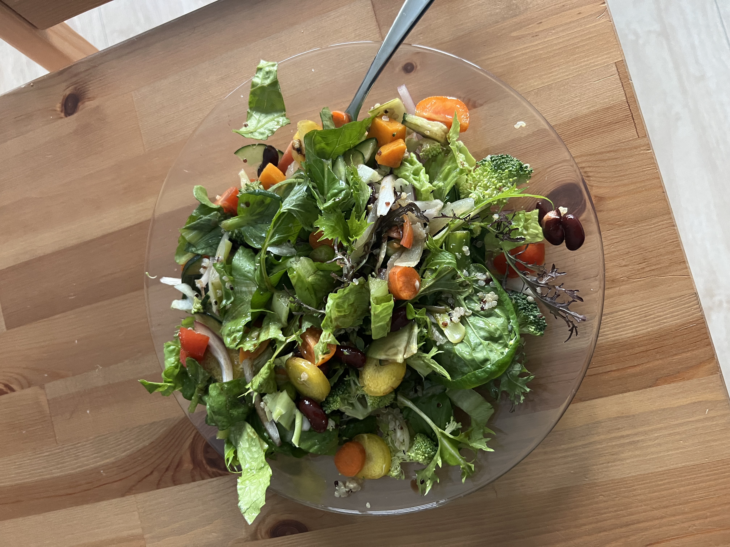 Garden salad with mustard greens, rainbow carrots, baby tomatoes, cucumber, red onion, quinoa and raw broccoli