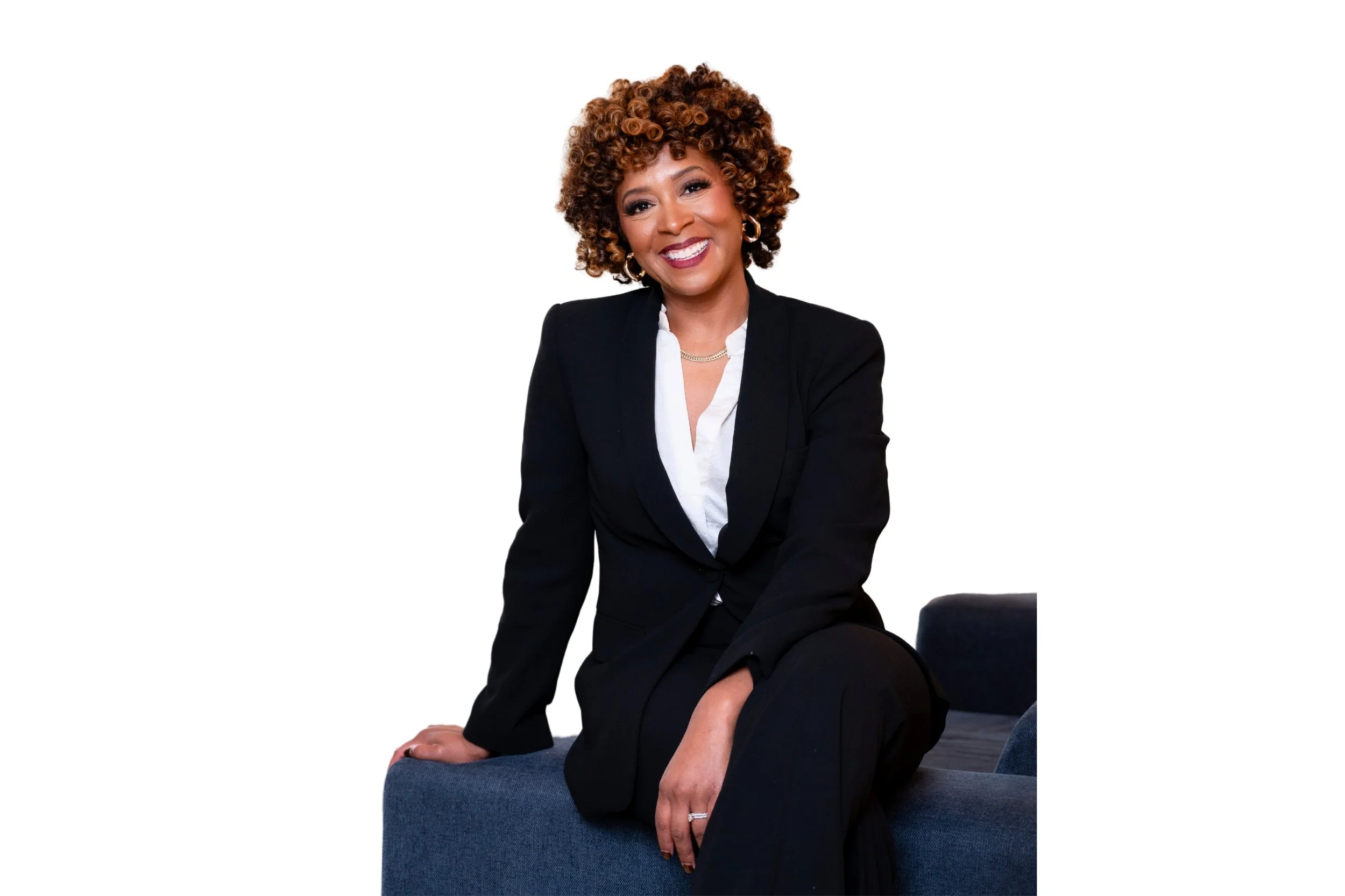 Attorney Porcha Davis sitting on her office smiling directly at the camera