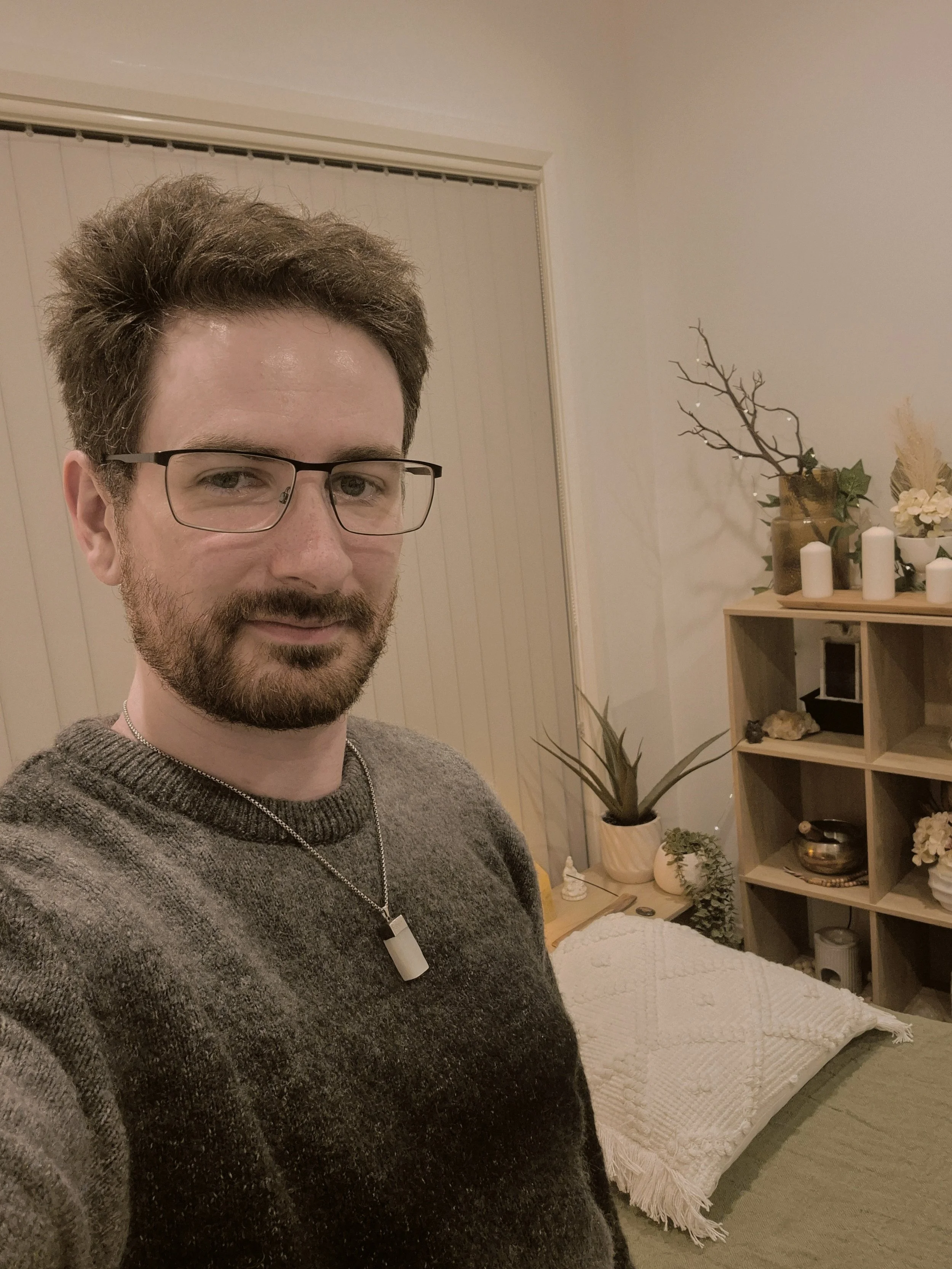 Reiki Master Practitioner in spiritual wellness room for renewal