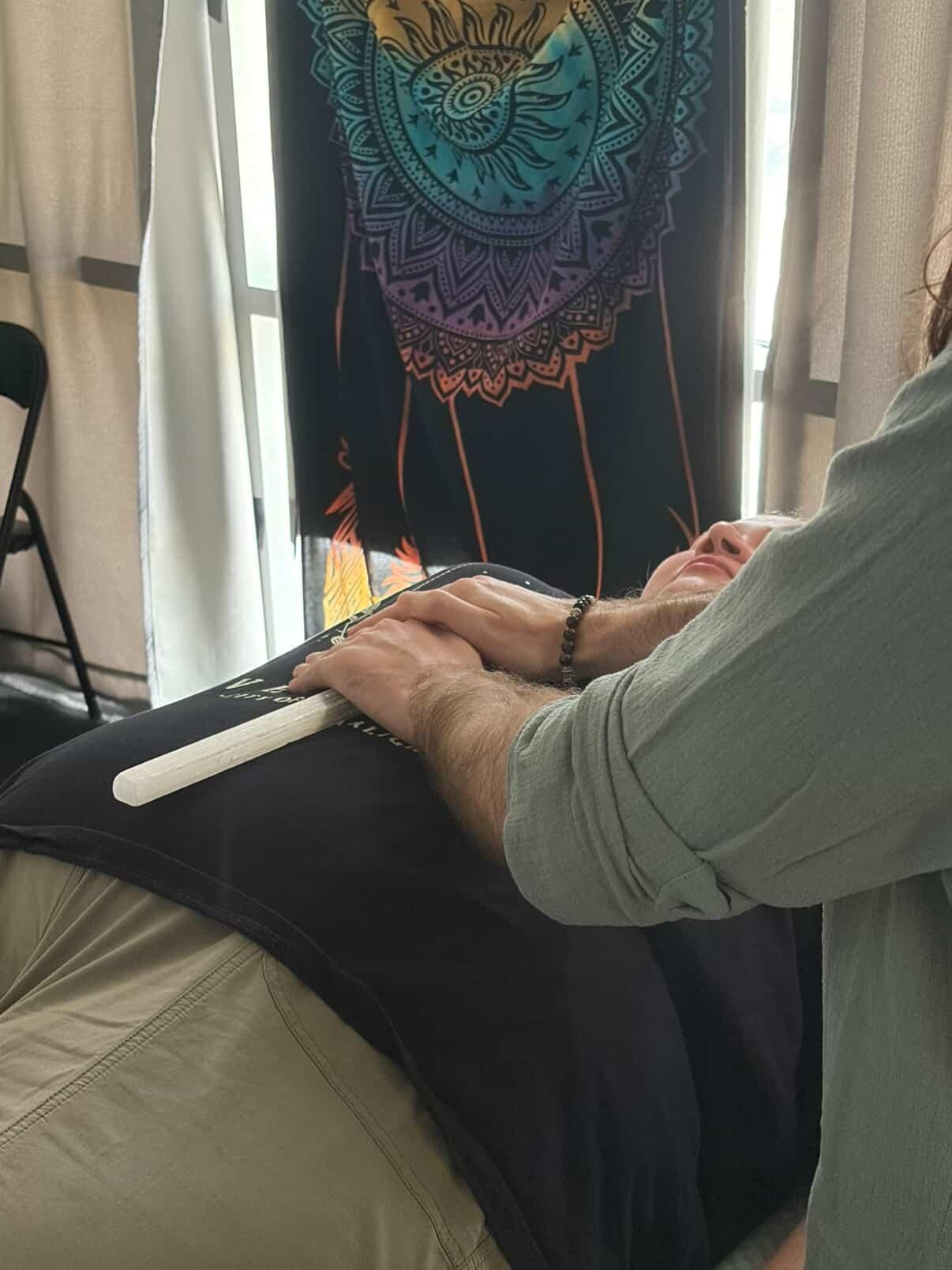 Reiki Master giving a Traditional Usui Reiki session with a client. Channeling Reiki healing energy into the Solar Plexus Chakra