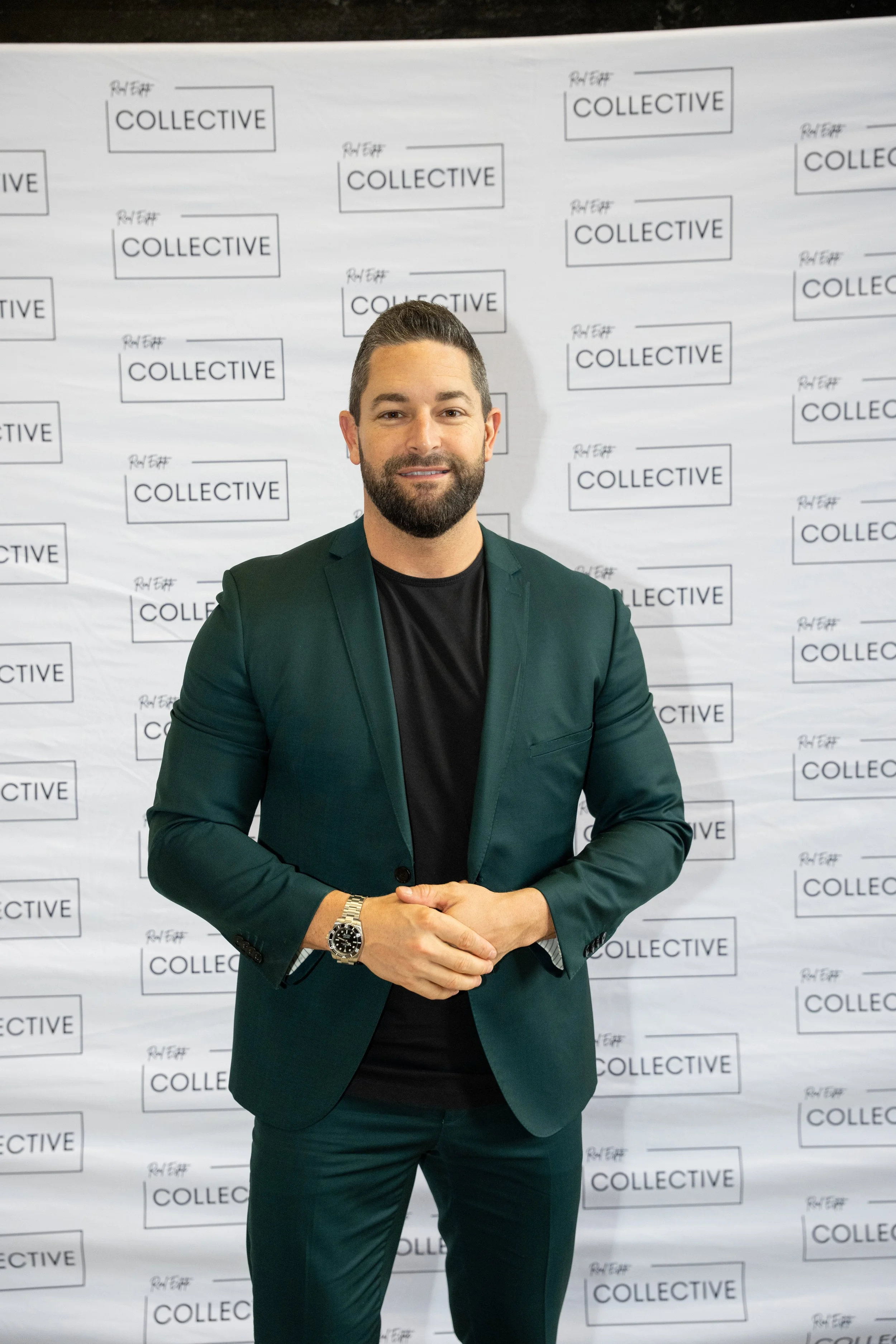 Someone Posing at an Event by a backdrop