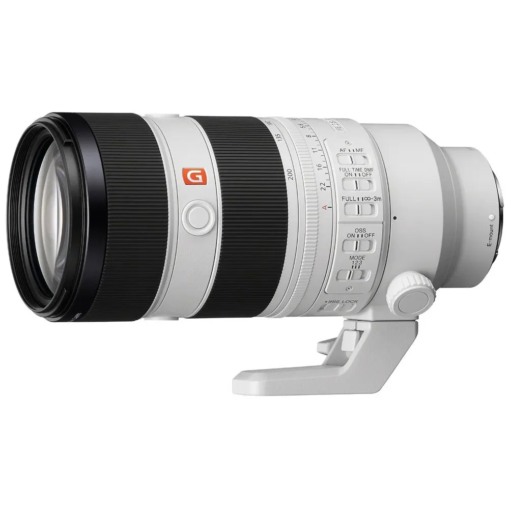 A white professional telephoto camera lens with various adjustment switches and a tripod mount on a white background.