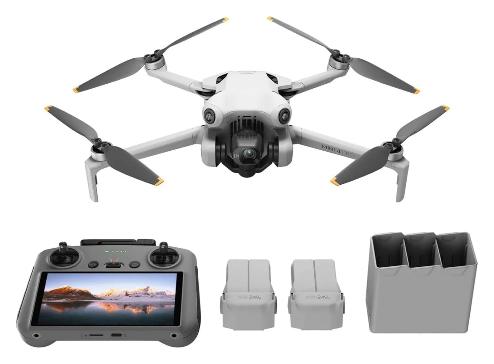 A drone with a remote control and extra batteries.