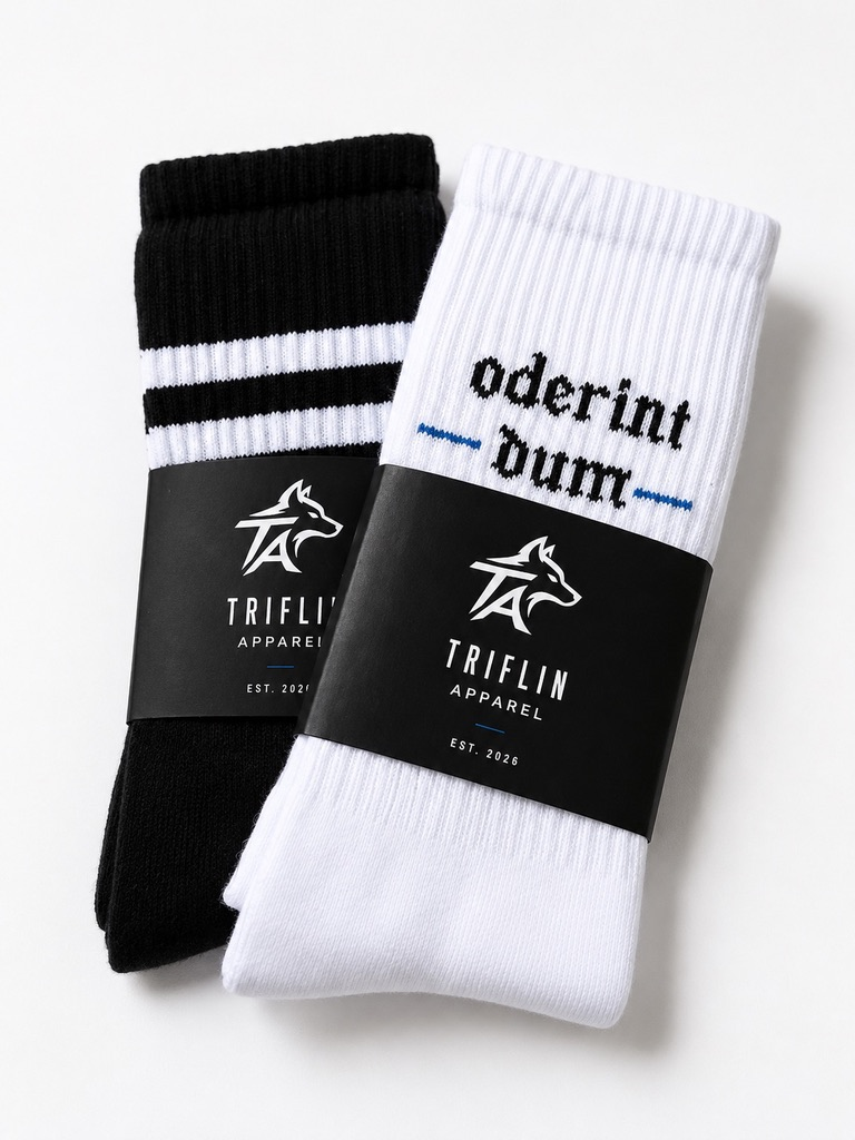 Two pairs of athletic socks, one black with white stripes and the other white with black and blue text, wrapped in black TRIFLIN APPAREL bands.