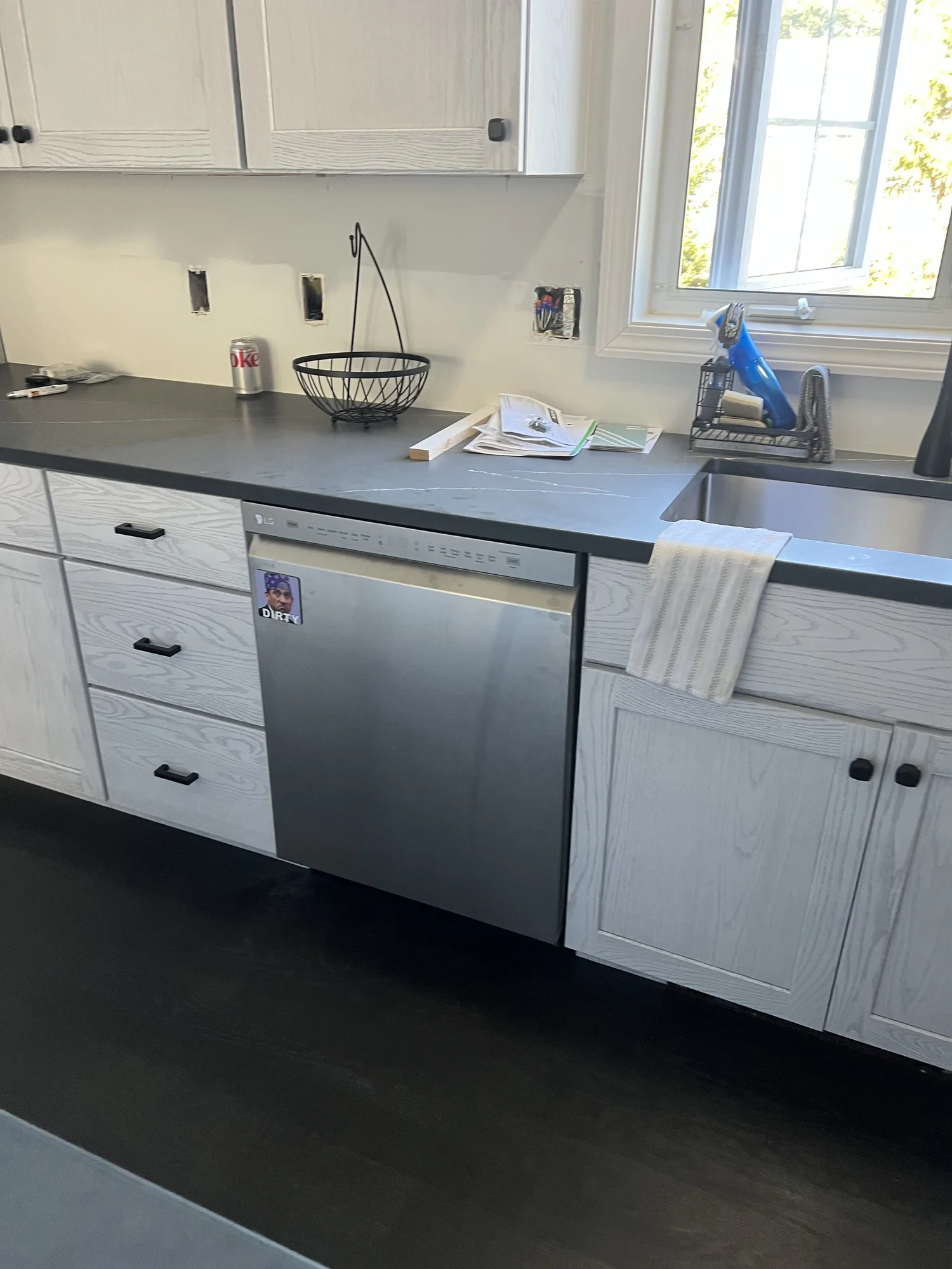 Kitchen with new quartz countertop, undermount sink and dishwasher installed