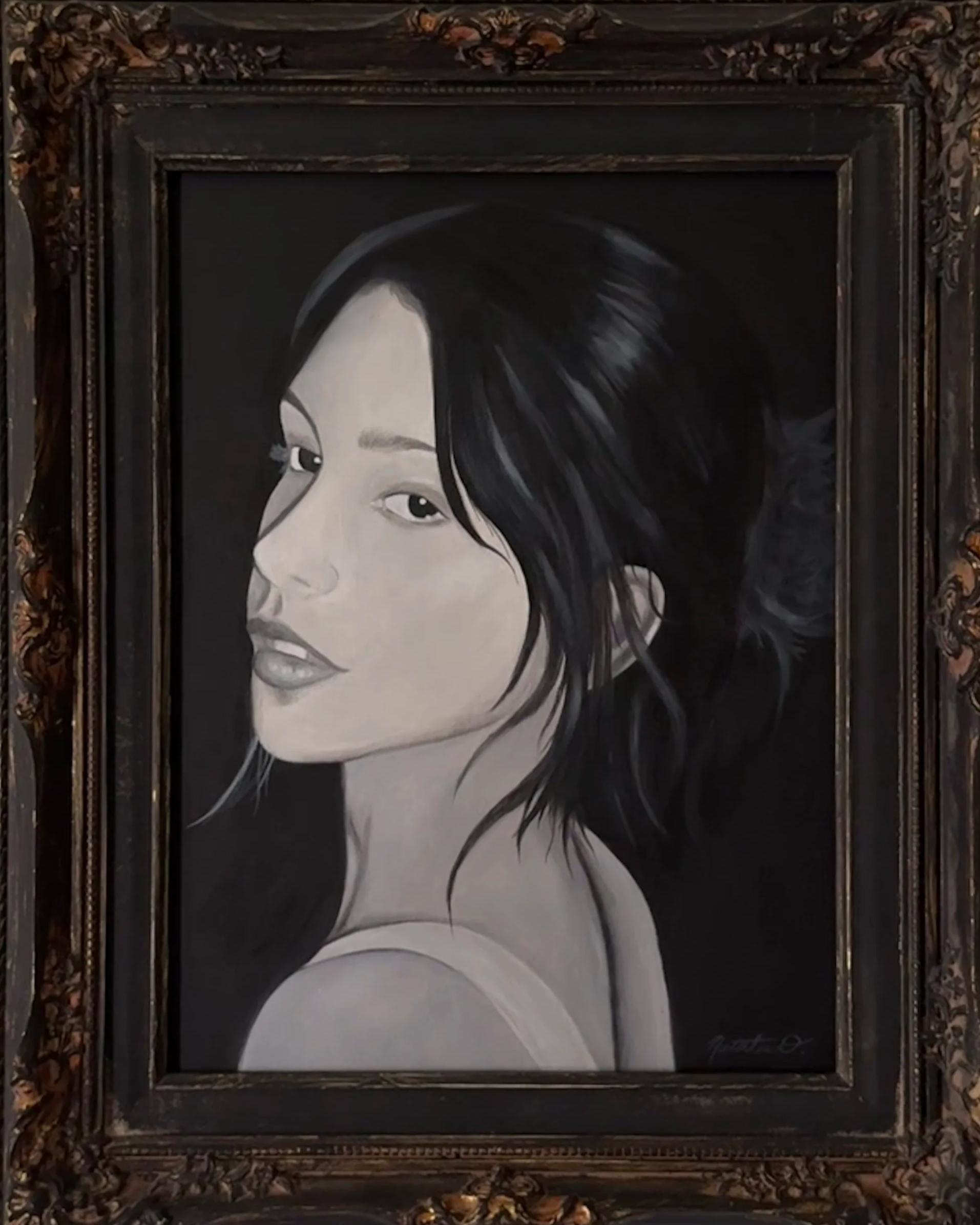 A monochrome portrait of a woman with dark hair, focusing on her face in profile.
