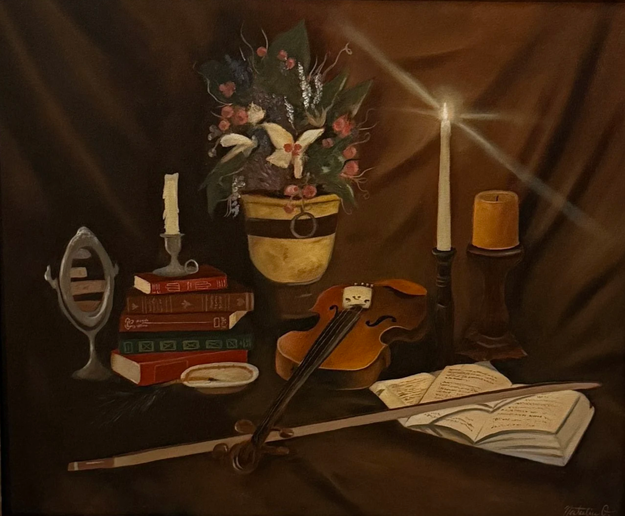 Still life painting featuring a stack of red and green books, a silver mirror, a white candle on a candlestick, a yellow and black vase with a flower arrangement, a small painted violin, an open book, and two candles on dark wooden surfaces.