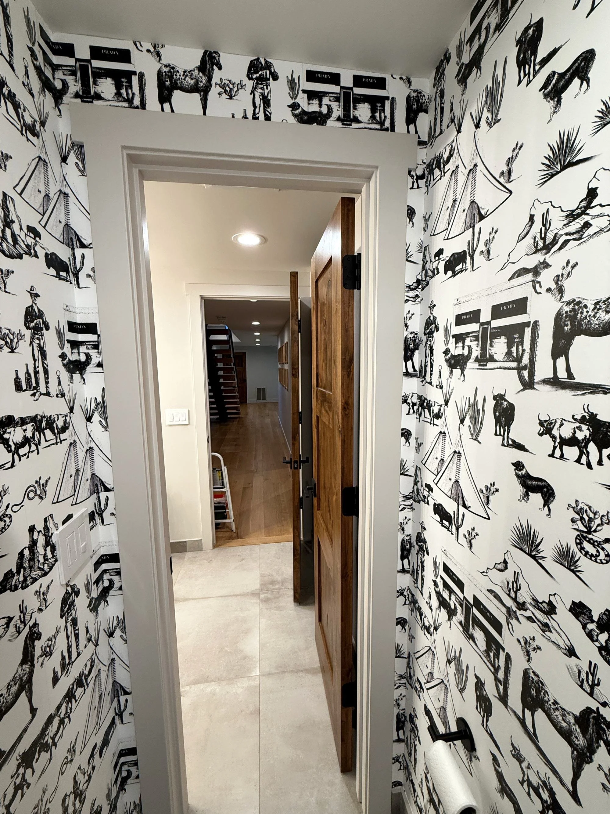Black and white wallpaper installation in hallway and powder room in Denver, CO