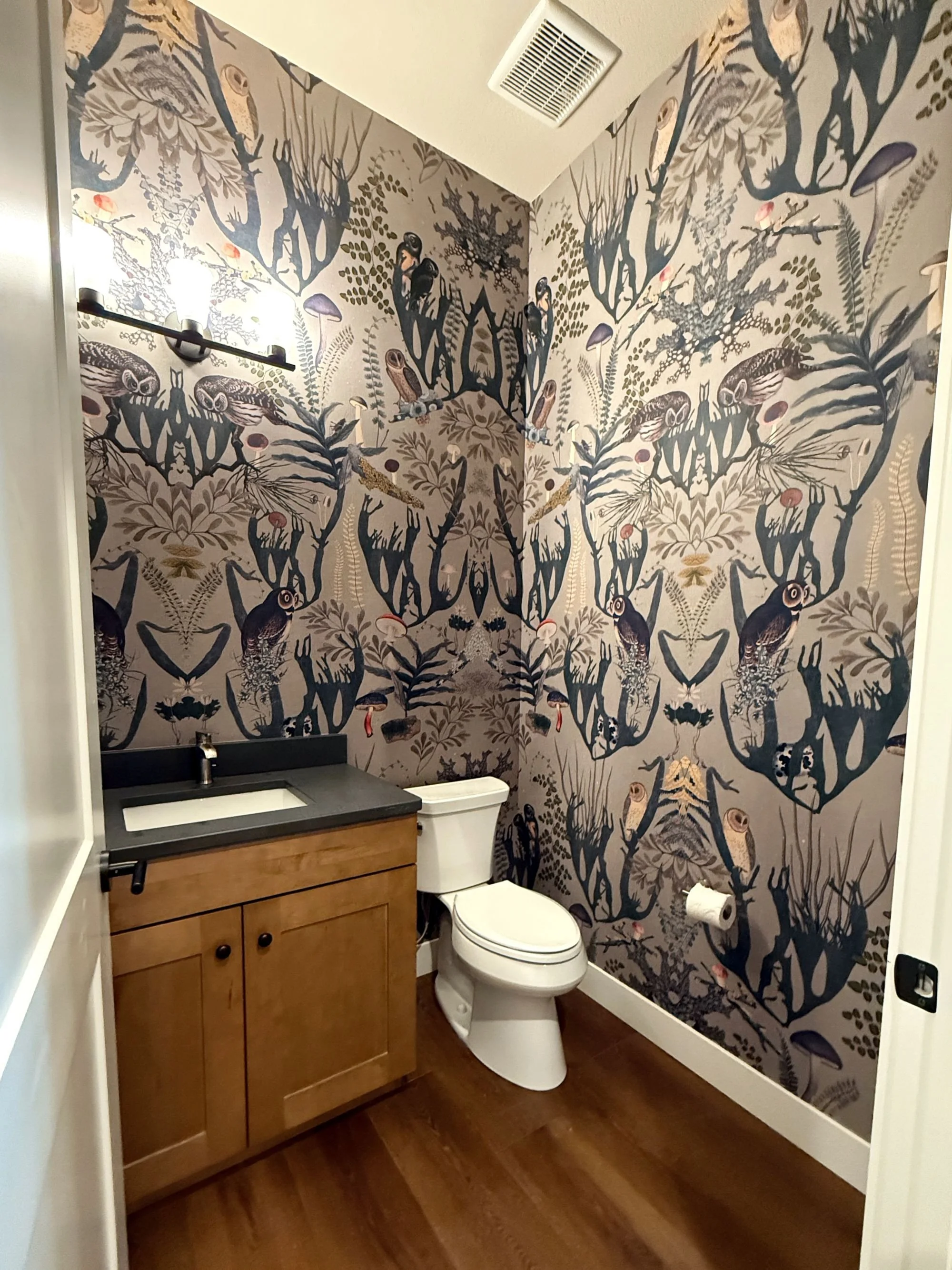 Powder room wallpaper installation with bold graphic pattern in Denver, CO