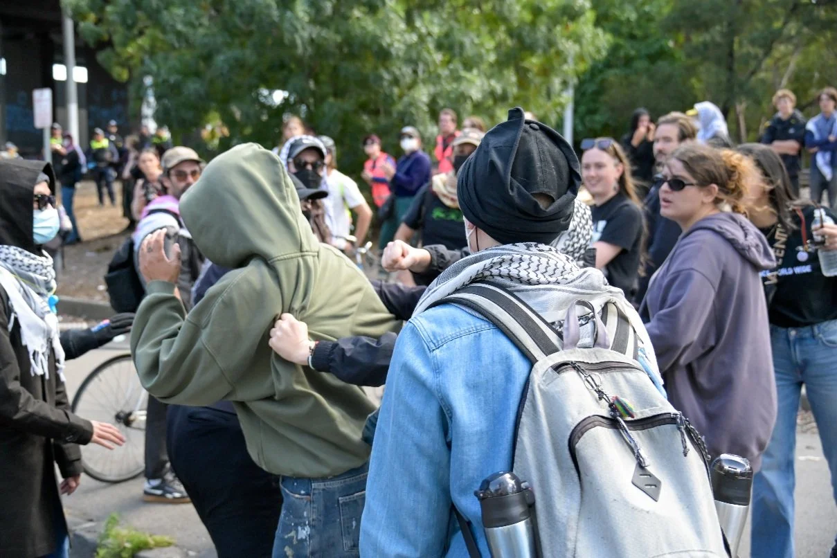Documentary photograph taken during the Israeli President’s visit to Melbourne on 12 February, capturing protests in Southbank and the CBD, police security measures, and street-level tensions. | photo by Farhad Rajabali