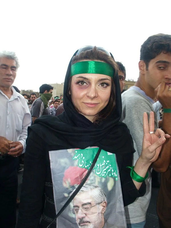 Editorial photograph from the Green Movement protests in Iran during 2009–2010, documenting public demonstrations, civic resistance, and everyday life under heightened security conditions. Part of a long-form documentary project by photographer Farha