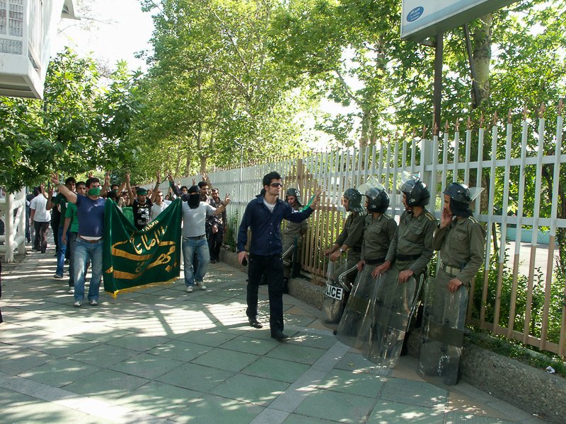 Editorial photograph from the Green Movement protests in Iran during 2009–2010, documenting public demonstrations, civic resistance, and everyday life under heightened security conditions. Part of a long-form documentary project by photographer Farha