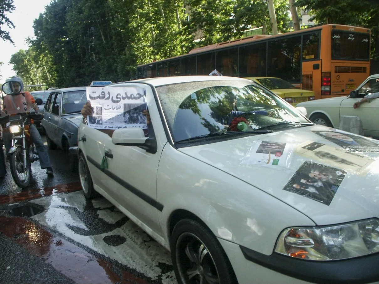 This image is part of the Green Movement documentary series, recorded during the 2009 protests in Tehran, Iran. The project documents everyday scenes and public demonstrations, reflecting resilience, collective presence, and civilian life during a si