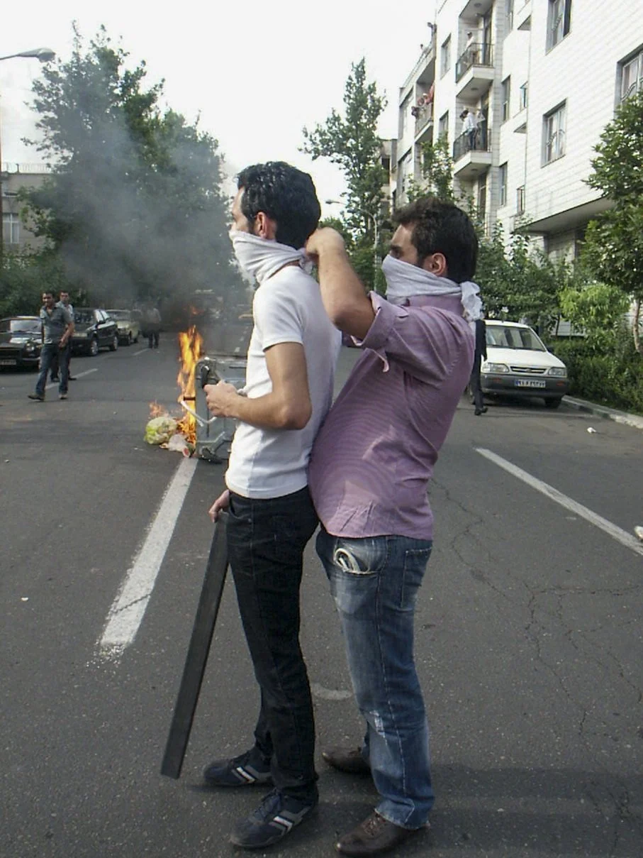 This image is part of the Green Movement documentary series, recorded during the 2009 protests in Tehran, Iran. The project documents everyday scenes and public demonstrations, reflecting resilience, collective presence, and civilian life during a si