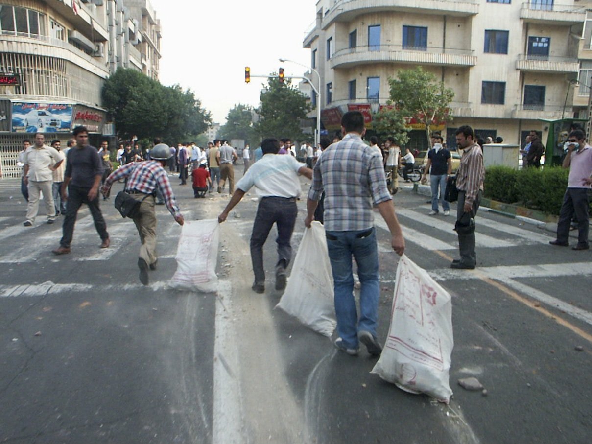 This image is part of the Green Movement documentary series, recorded during the 2009 protests in Tehran, Iran. The project documents everyday scenes and public demonstrations, reflecting resilience, collective presence, and civilian life during a si