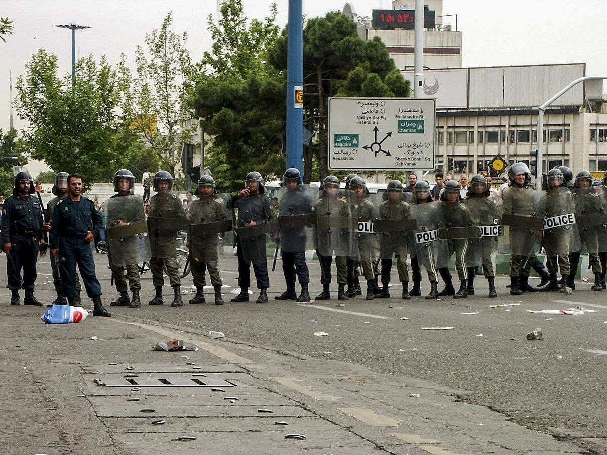 This image is part of the Green Movement documentary series, recorded during the 2009 protests in Tehran, Iran. The project documents everyday scenes and public demonstrations, reflecting resilience, collective presence, and civilian life during a si