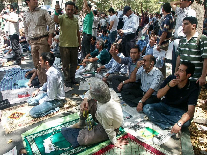 Editorial photograph from the Green Movement protests in Iran during 2009–2010, documenting public demonstrations, civic resistance, and everyday life under heightened security conditions. Part of a long-form documentary project by photographer Farha