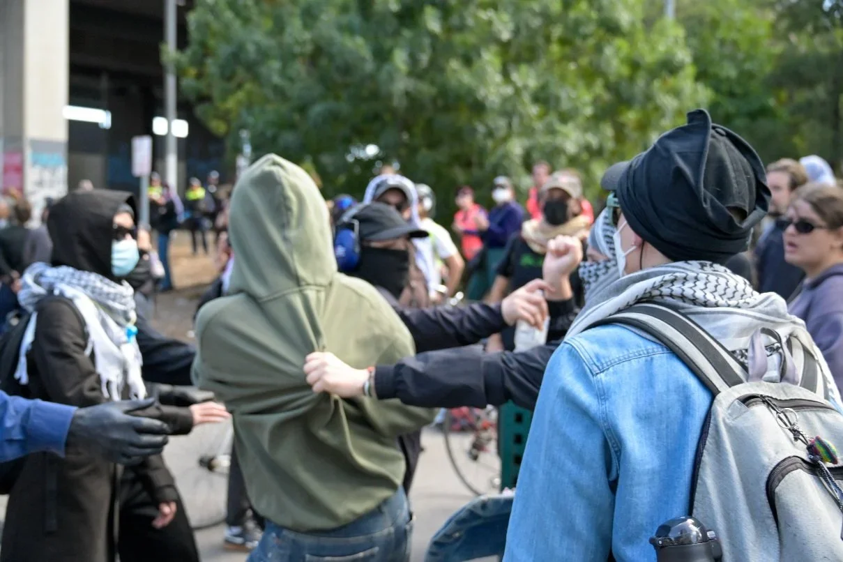 Documentary photograph taken during the Israeli President’s visit to Melbourne on 12 February 2026, capturing protests in Southbank and the CBD, police security measures, and street-level tensions. Photo by Farhad Rajabali | Artssie