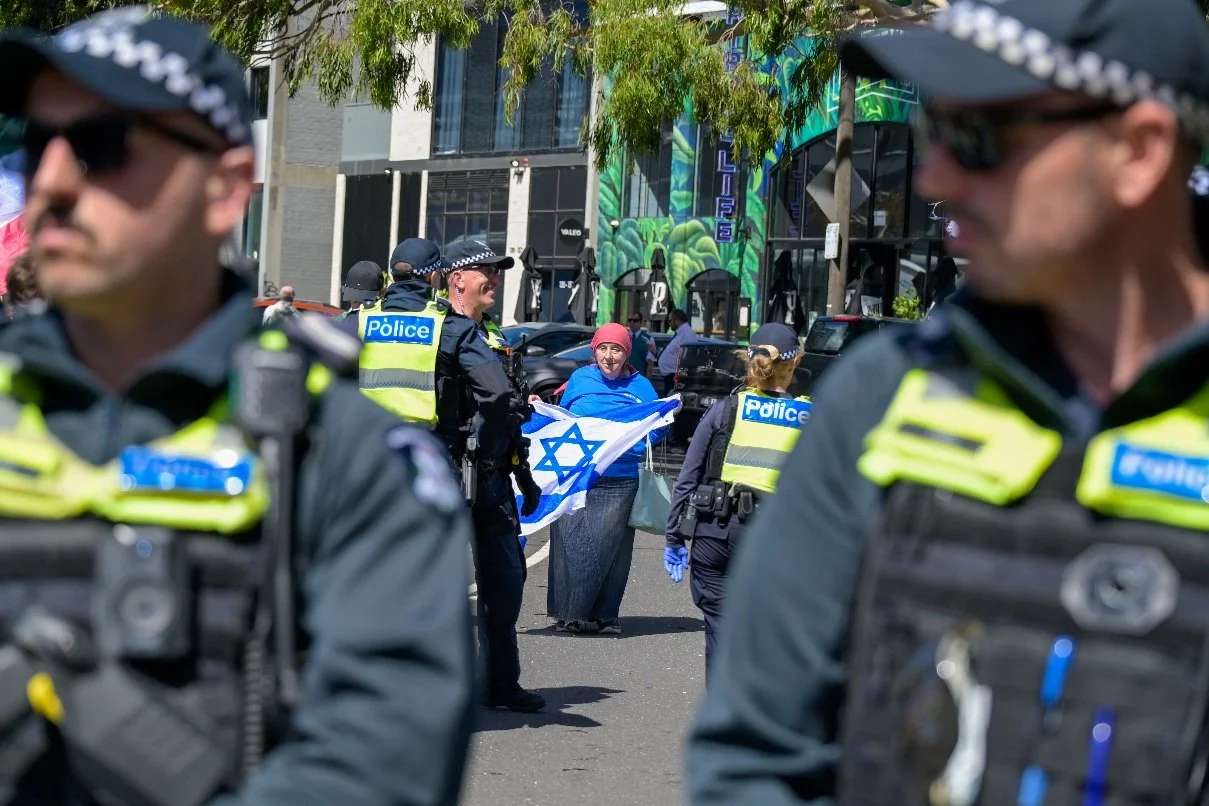 Documentary photograph taken during the Israeli President’s visit to Melbourne on 12 February, capturing protests in Southbank and the CBD, police security measures, and street-level tensions. | photo by Farhad Rajabali