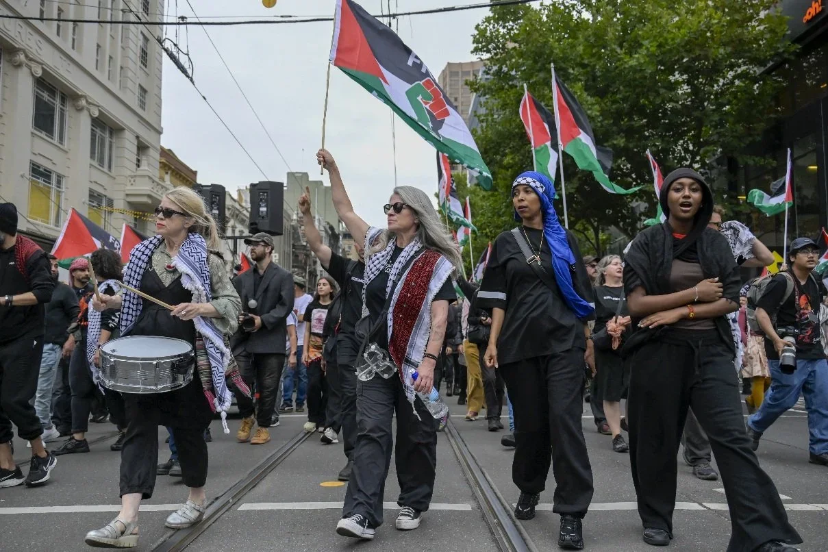Documentary photograph from a pro-Palestine march through Melbourne’s CBD, capturing public protest, political expression, and street-level moments.
Photo by Farhad Rajabali | Artssie