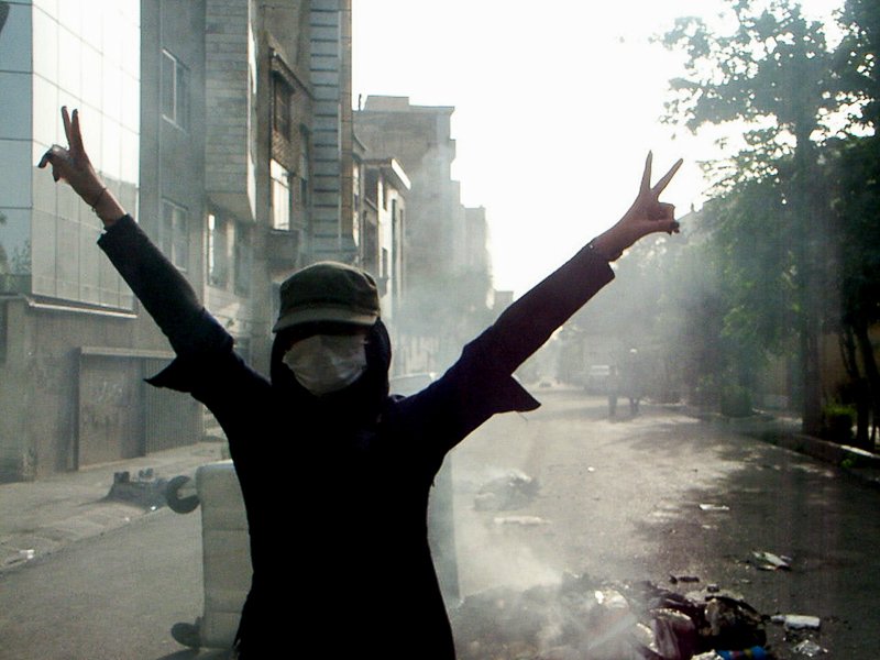 Editorial photograph from the Green Movement protests in Iran during 2009–2010, documenting public demonstrations, civic resistance, and everyday life under heightened security conditions. Part of a long-form documentary project by photographer Farha