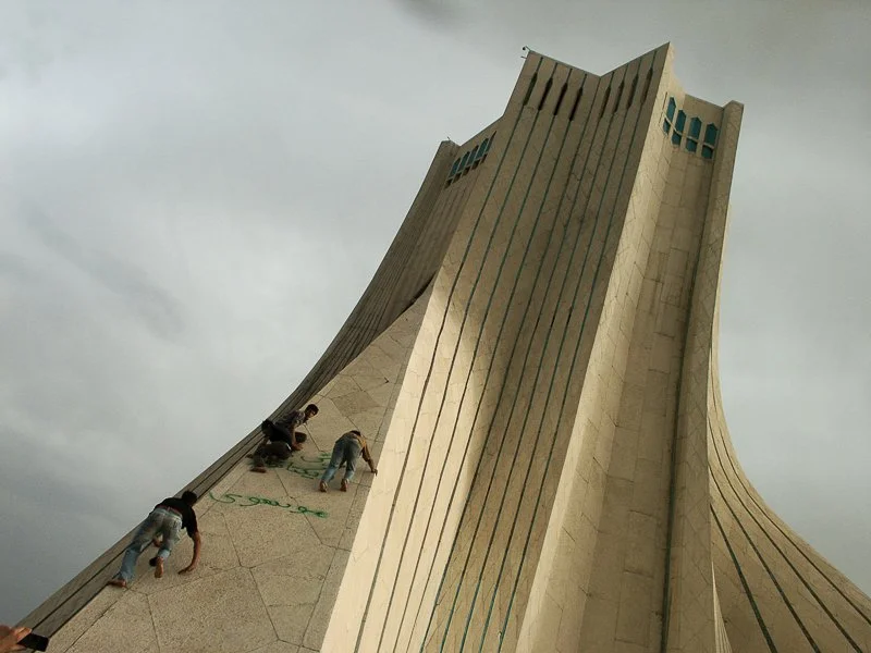 Editorial photograph from the Green Movement protests in Iran during 2009–2010, documenting public demonstrations, civic resistance, and everyday life under heightened security conditions. Part of a long-form documentary project by photographer Farha
