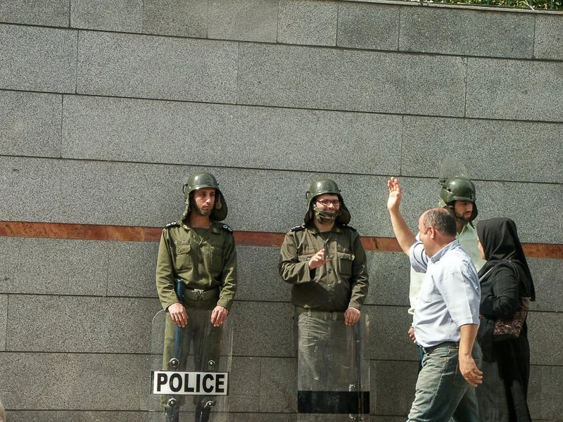 Editorial photograph from the Green Movement protests in Iran during 2009–2010, documenting public demonstrations, civic resistance, and everyday life under heightened security conditions. Part of a long-form documentary project by photographer Farha