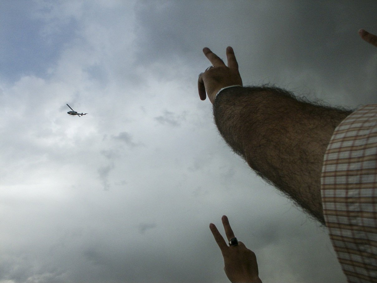 This image is part of the Green Movement documentary series, recorded during the 2009 protests in Tehran, Iran. The project documents everyday scenes and public demonstrations, reflecting resilience, collective presence, and civilian life during a si