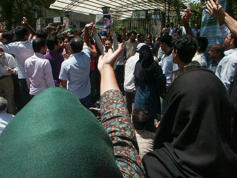 Editorial photograph from the Green Movement protests in Iran during 2009–2010, documenting public demonstrations, civic resistance, and everyday life under heightened security conditions. Part of a long-form documentary project by photographer Farha