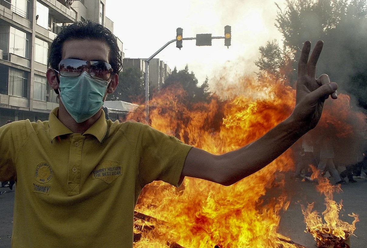 This image is part of the Green Movement documentary series, recorded during the 2009 protests in Tehran, Iran. The project documents everyday scenes and public demonstrations, reflecting resilience, collective presence, and civilian life during a si