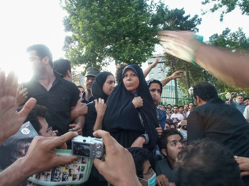 Editorial photograph from the Green Movement protests in Iran during 2009–2010, documenting public demonstrations, civic resistance, and everyday life under heightened security conditions. Part of a long-form documentary project by photographer Farha