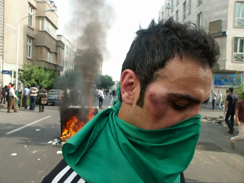 Editorial photograph from the Green Movement protests in Iran during 2009–2010, documenting public demonstrations, civic resistance, and everyday life under heightened security conditions. Part of a long-form documentary project by photographer Farha
