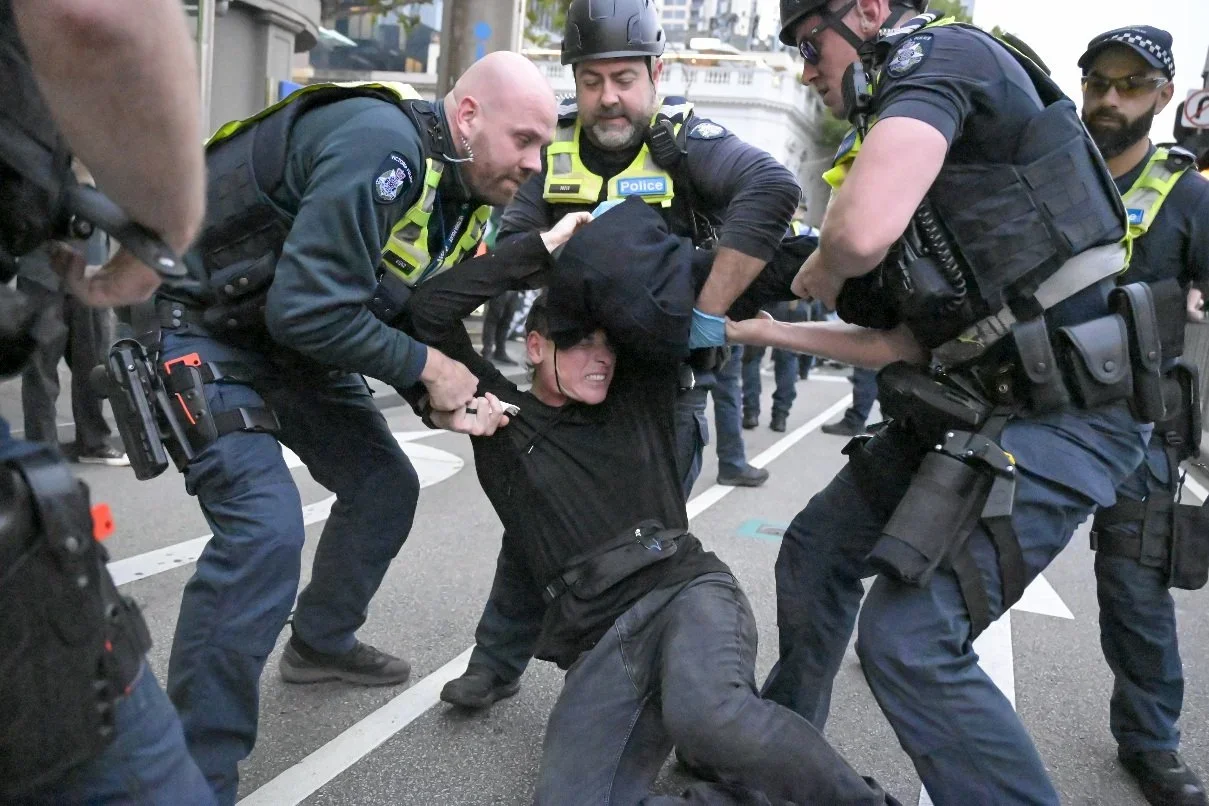 Documentary photograph from a pro-Palestine march through Melbourne’s CBD, capturing public protest, political expression, and street-level moments.
Photo by Farhad Rajabali | Artssie