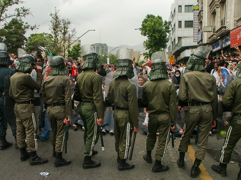 Editorial photograph from the Green Movement protests in Iran during 2009–2010, documenting public demonstrations, civic resistance, and everyday life under heightened security conditions. Part of a long-form documentary project by photographer Farha