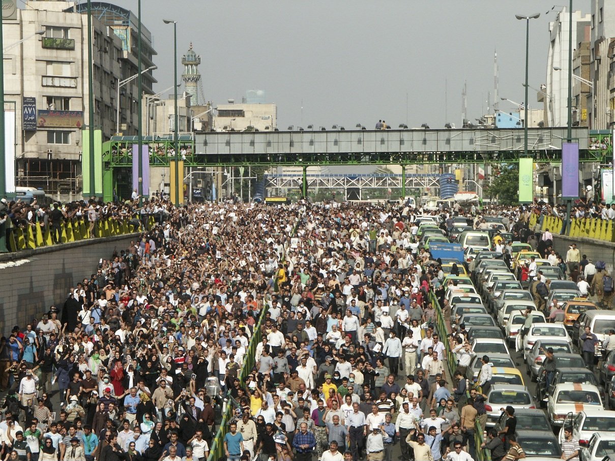 This image is part of the Green Movement documentary series, recorded during the 2009 protests in Tehran, Iran. The project documents everyday scenes and public demonstrations, reflecting resilience, collective presence, and civilian life during a si
