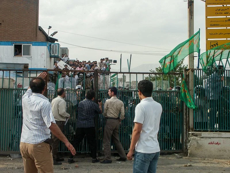 Editorial photograph from the Green Movement protests in Iran during 2009–2010, documenting public demonstrations, civic resistance, and everyday life under heightened security conditions. Part of a long-form documentary project by photographer Farha