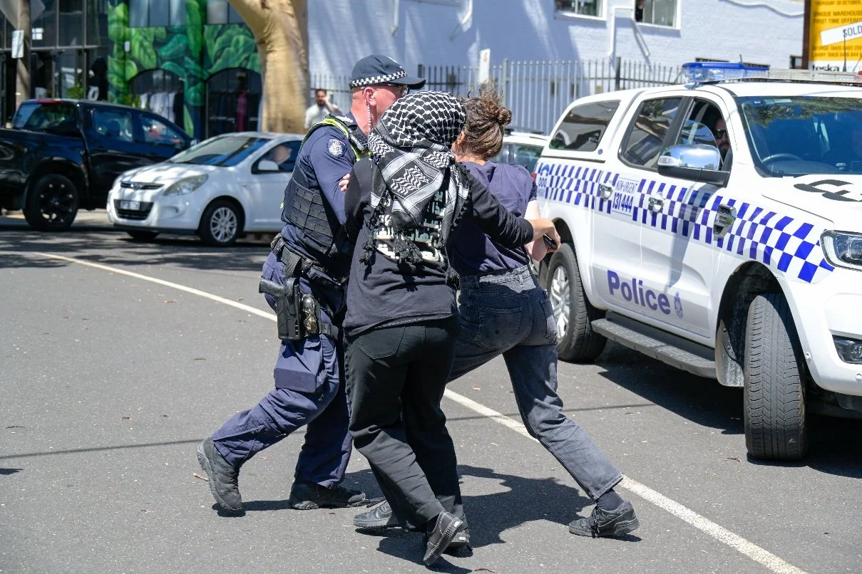 Documentary photograph taken during the Israeli President’s visit to Melbourne on 12 February, capturing protests in Southbank and the CBD, police security measures, and street-level tensions. | photo by Farhad Rajabali