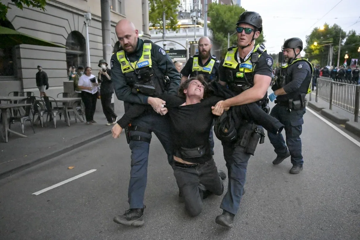 Documentary photograph from a pro-Palestine march through Melbourne’s CBD, capturing public protest, political expression, and street-level moments.
Photo by Farhad Rajabali | Artssie