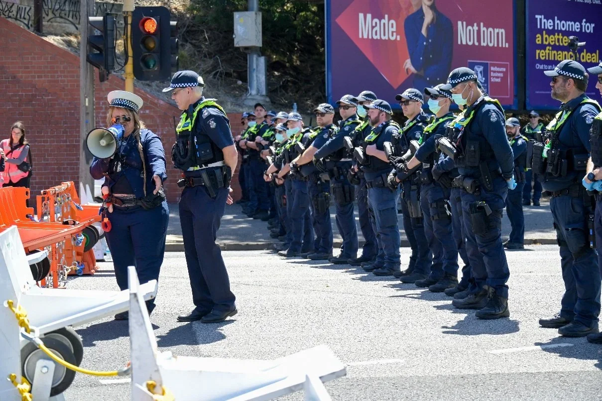 Documentary photograph taken during the Israeli President’s visit to Melbourne on 12 February 2026, capturing protests in Southbank and the CBD, police security measures, and street-level tensions. Photo by Farhad Rajabali | Artssie