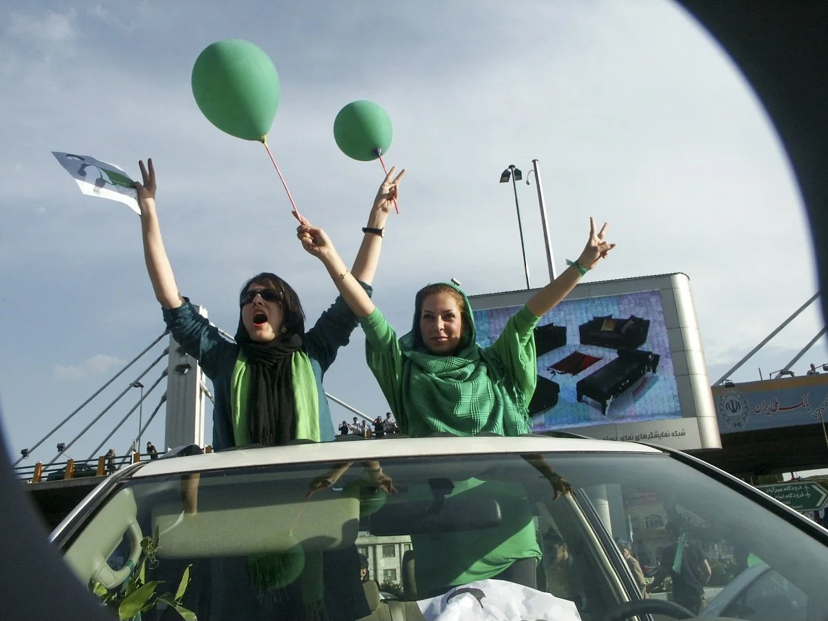 This image is part of the Green Movement documentary series, recorded during the 2009 protests in Tehran, Iran. The project documents everyday scenes and public demonstrations, reflecting resilience, collective presence, and civilian life during a si