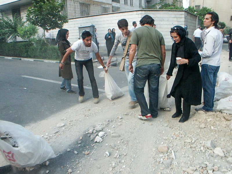 Editorial photograph from the Green Movement protests in Iran during 2009–2010, documenting public demonstrations, civic resistance, and everyday life under heightened security conditions. Part of a long-form documentary project by photographer Farha