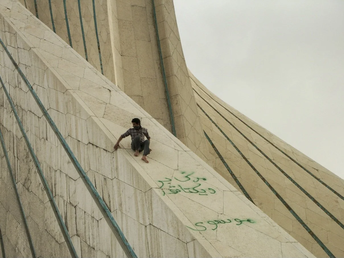 This image is part of the Green Movement documentary series, recorded during the 2009 protests in Tehran, Iran. The project documents everyday scenes and public demonstrations, reflecting resilience, collective presence, and civilian life during a si