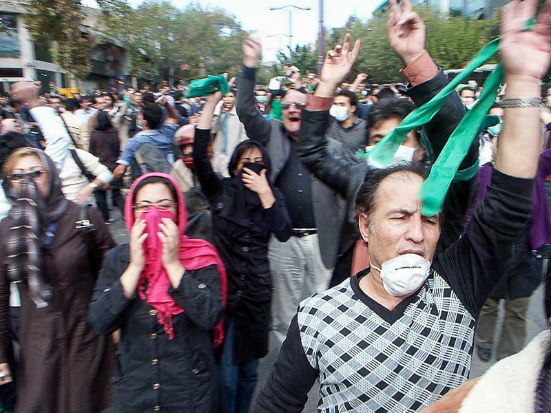Editorial photograph from the Green Movement protests in Iran during 2009–2010, documenting public demonstrations, civic resistance, and everyday life under heightened security conditions. Part of a long-form documentary project by photographer Farha