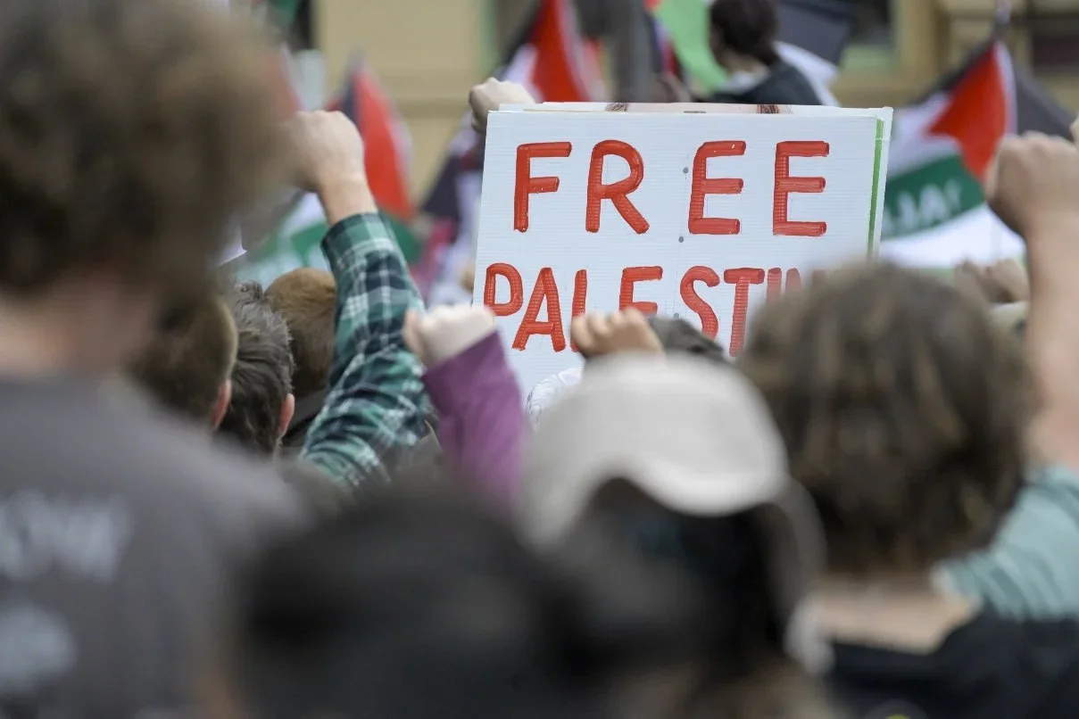 Documentary photograph from a pro-Palestine march through Melbourne’s CBD, capturing public protest, political expression, and street-level moments.
Photo by Farhad Rajabali | Artssie
