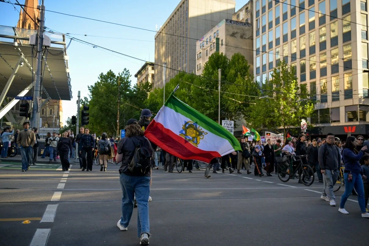 Documentary photograph taken during the Israeli President’s visit to Melbourne on 12 February, capturing protests in Southbank and the CBD, police security measures, and street-level tensions. | photo by Farhad Rajabali