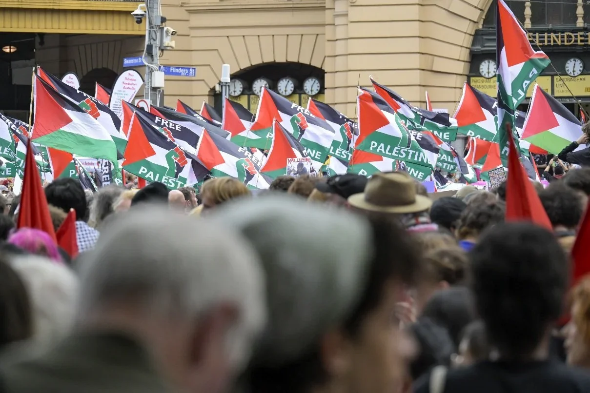 Documentary photograph from a pro-Palestine march through Melbourne’s CBD, capturing public protest, political expression, and street-level moments.
Photo by Farhad Rajabali | Artssie