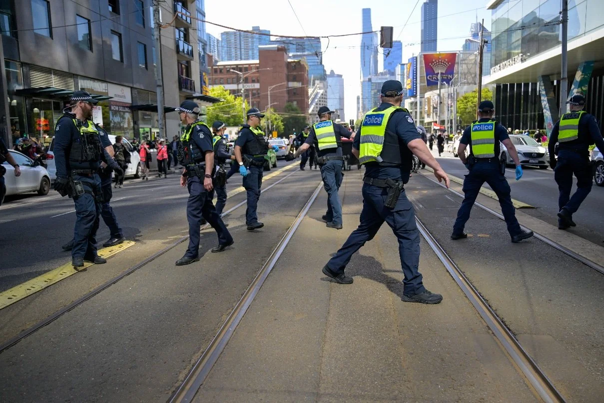 Documentary photograph taken during the Israeli President’s visit to Melbourne on 12 February, capturing protests in Southbank and the CBD, police security measures, and street-level tensions. | photo by Farhad Rajabali