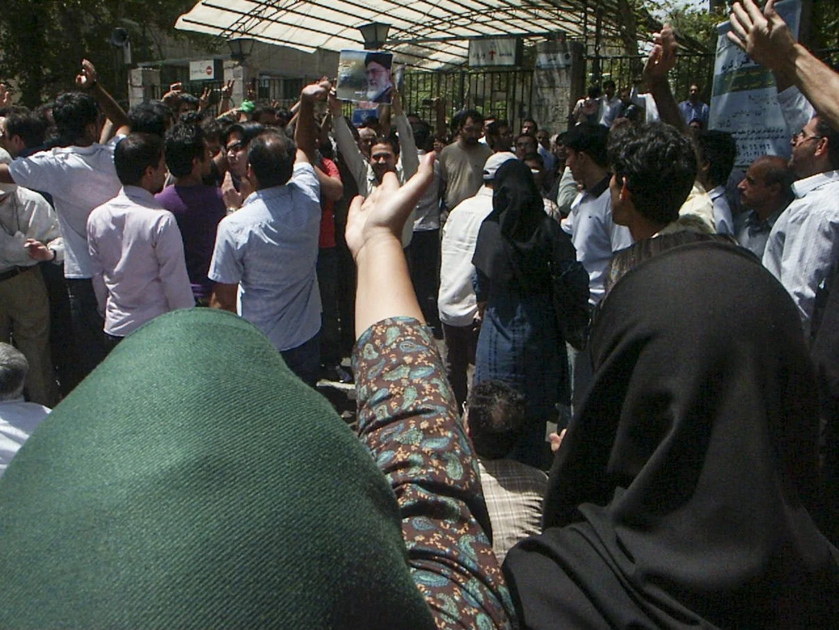 This image is part of the Green Movement documentary series, recorded during the 2009 protests in Tehran, Iran. The project documents everyday scenes and public demonstrations, reflecting resilience, collective presence, and civilian life during a si